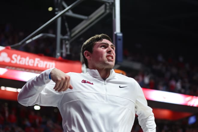 Ole Miss basketball student manager Kyle Wakefield pumps up the crowd during Tuesday's win over Mississippi State.