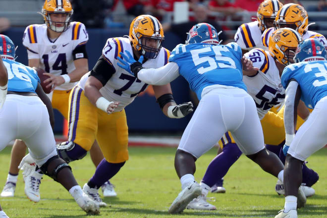 Ole Miss defensive lineman KD Hill (55) will have his hands full Thursday rushing Mississippi State quarterback Will Rogers.