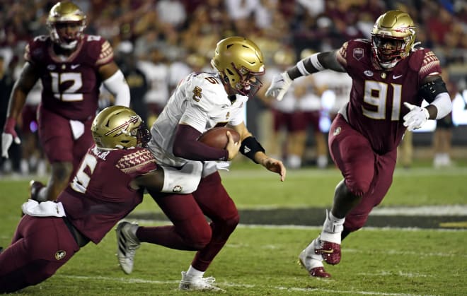 Boston College QB Phil Jurkovec (with ball) has spent much of his 2022 season under duress. 