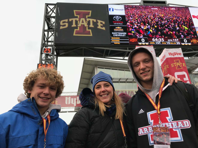Chandler Pulvermacher (right) with his mother and younger brother during a game-day visit.