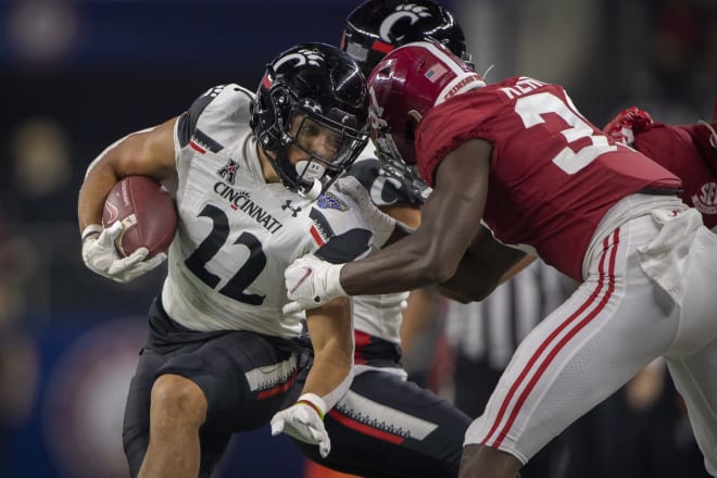 Cincinnati Bearcats safety De'Arre McDonald (22) is tackled by Alabama Crimson Tide linebacker Demouy Kennedy (37) during the third quarter during the 2021 Cotton Bowl college football CFP national semifinal game at AT&T Stadium. Photo | Jerome Miron-USA TODAY Sports