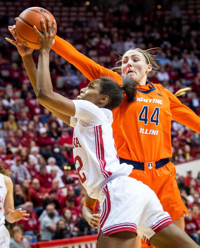 Indiana's Chloe Moore-McNeil (22) is blocked by Illinois' Kendall Bostic (44) during the second half of the Indiana versus Illinois women's basketball game at Simon Skjodt Assembly Hall on Sunday, Dec. 4, 2022.