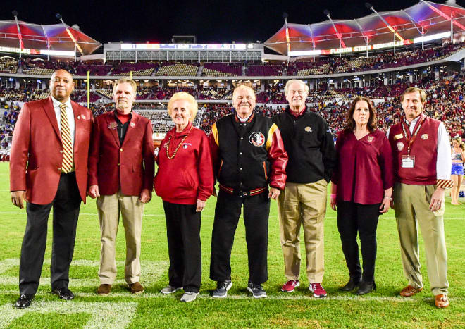 Judy and Al Dunlap (center) were recognized at Doak Campbell Stadium last November for their $5 million contribution to the Champions Club, which is pictured above them.