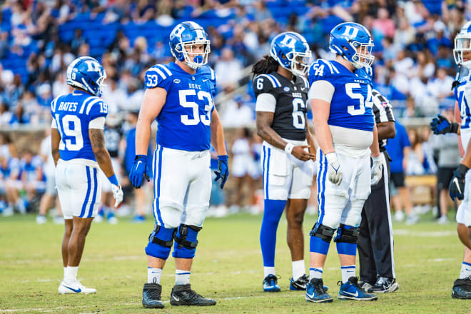 Duke's Brian Parker II, No. 53, and Ethan Hubbard, No. 54, line up during Duke's Blue & White game. 