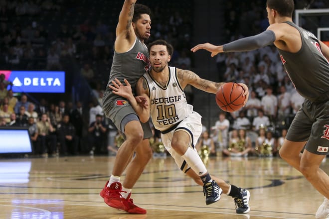 Jose Alvarado drives to the hoop against Louisville