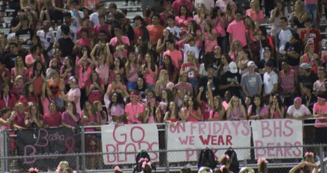 The students at Jim Wall Stadium at Basha HS in Chandler cheer on their Bears during an October pinkout game.  The season gets underway this Friday and Basha will play in front of the home crowd against North.