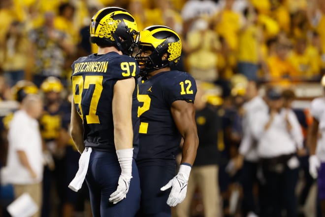 Michigan Wolverines football defenders Aidan Hutchinson and Josh Ross.