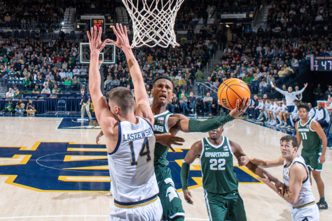 Michigan State's Tyson Walker tries to score on Notre Dame's Nate Laszewski in the ACC/Big Ten Challenge matchup in South Bend, IN on Nov. 30, 2022. Photo Credit: Matt Cashore-USA TODAY Sports