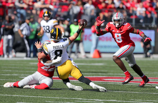 Iowa's oh-so-very-close upset bid at Ohio State ended on this dirty play by the Buckeyes. Here's Iowa quarterback Alex Padilla, who saves puppies and escorts elderly women to doctors appointments in his spare time, is unleashing a beautiful throw when he is hit late and low by an Ohio State defender. The helmet, likely packed with illegal objects, caused Mr. Padilla, who also calls his mother every day to tell her he loves her, to throw an errant pass. Otherwise, Iowa wins and Ohio State's march to the Big Ten title goes off the tracks. Crazy thing about college football, really. The wonderful people play the game the right way but the sport rewards cheating. Stay strong, Mr. Padilla, and Go Hawkeyes!