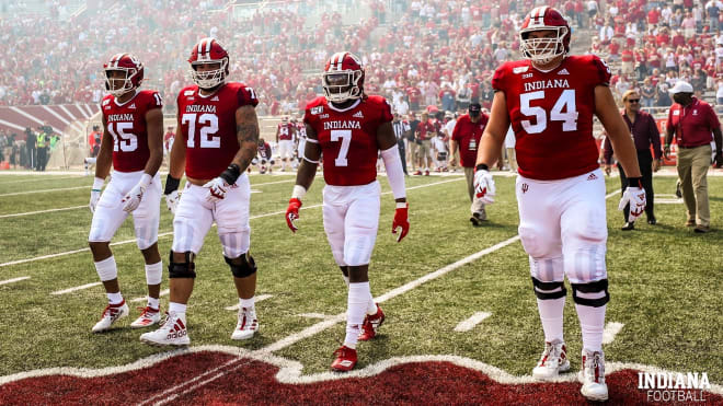 Nick Westbrook-Ikhine, Simon Stepaniak, Raekwon Jones and Coy Cronk head to midfield for the coin toss. (Credit: IU Athletics) 