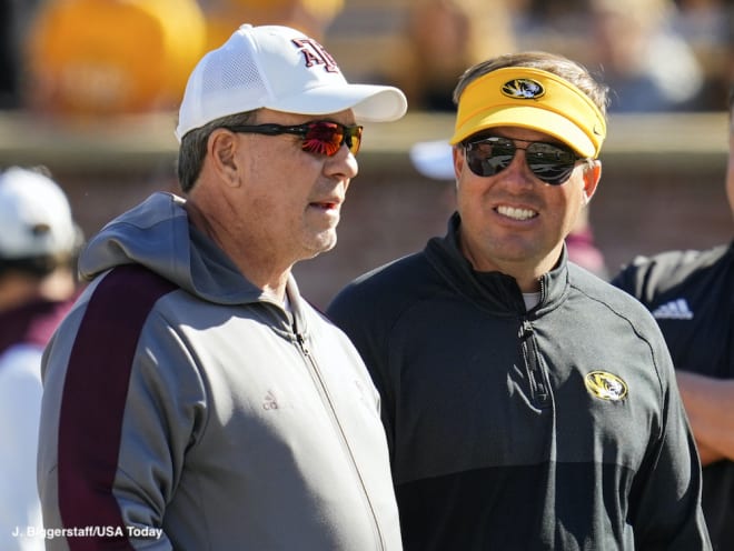 Eli Drinkwitz talks with A&M head coach Jimbo Fisher before the Aggies' 35-14 win