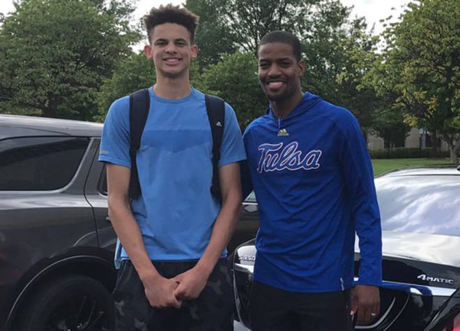 Christian Bishop (left) with Tulsa assistant coach Kim English.