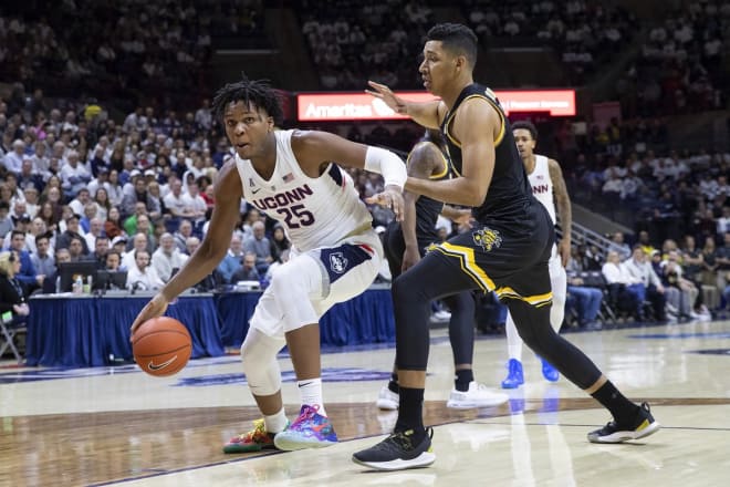 UConn's Josh Carlton drives in the paint for two of his game high twenty points in Sunday's win over ECU.