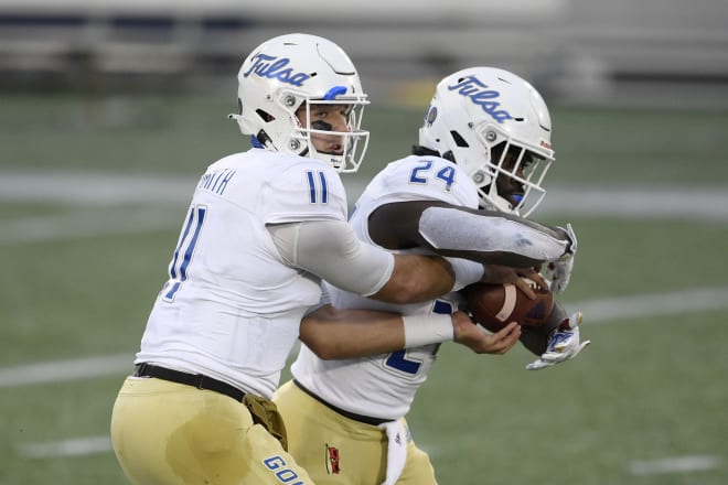 Tulsa QB Zach Smith hands off to running back Corey Taylor during a win over Navy.