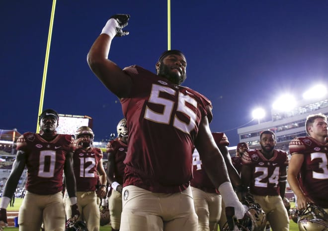 Sophomore offensive lineman Dontae Lucas and his teammates celebrate Saturday's win with the Marching Chiefs.