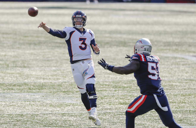 Denver Broncos quarterback Drew Lock (3) throws under pressure from New England Patriots linebacker Ja'Whaun Bentley (51) during the second quarter at Gillette Stadium.