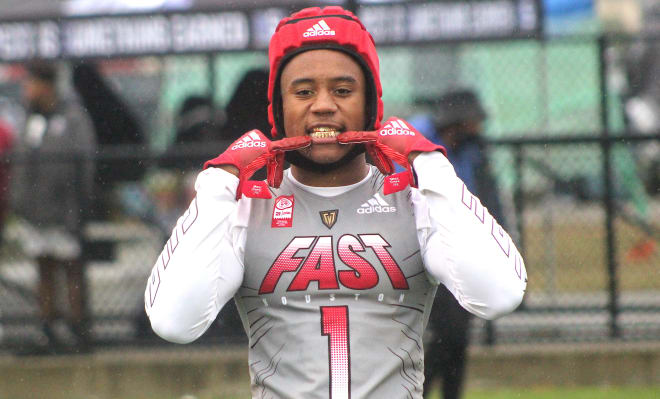 Texas defensive back Jaylon Guilbeau holds a Michigan Wolverines football recruiting offer from Jim Harbaugh.