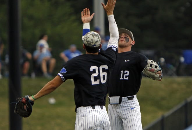 Kentucky's Chase Estep (12) celebrated the Wildcats' 6-3 win over Auburn with teammate Jacob Plastiak.