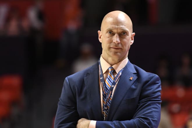 Illinois athletic director Josh Whitman watches before an NCAA college basketball game against Iowa Sunday, March 6, 2022, in Champaign, Ill.