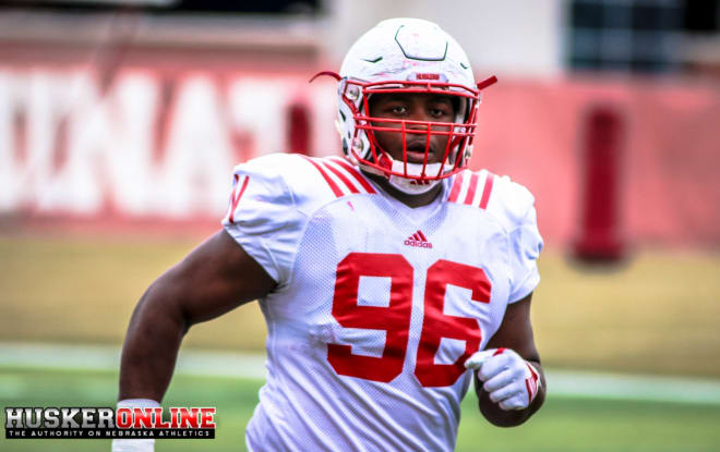Defensive lineman Carlos Davis joined his twin brother, Khalil, as the first two Nebraska players selected in the NFL Draft since 2018.