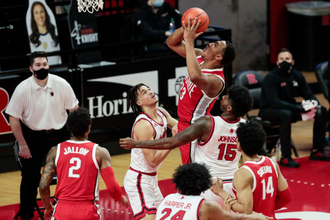 Jan 9, 2021; Piscataway, New Jersey, USA; Ohio State Buckeyes center Zed Key (23) shoots the ball as Rutgers Scarlet Knights center Myles Johnson (15) and guard Caleb McConnell (22) defend during the first half at Rutgers Athletic Center (RAC). 