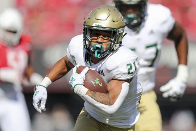 Oct 8, 2022; Cincinnati, Ohio, USA; South Florida Bulls running back Brian Battie (21) runs the ball in for a touchdown against the Cincinnati Bearcats in the first half at Nippert Stadium. 