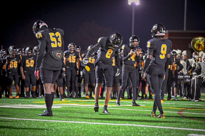  Rashaud Pernell (53), Braylon Johnson  (8), and Daquan Giles (9) lead the Springs onto the field against J.R. Tucker