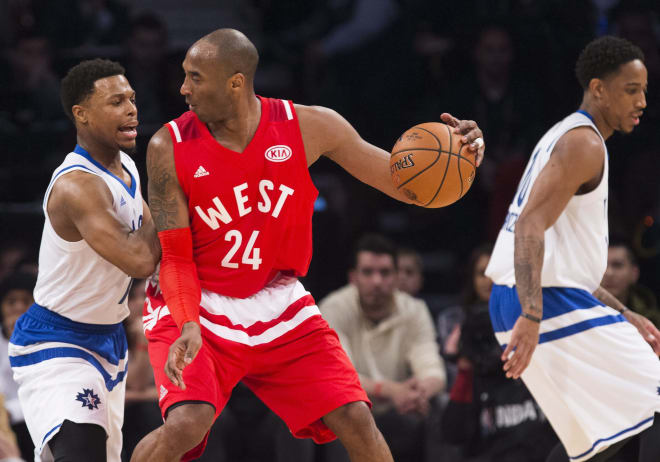Los Angeles Lakers forward Kobe Bryant works against Toronto Raptors guard Kyle Lowry Sunday night in Toronto. Bryant played in his 18th and final NBA All-Star Game Sunday.