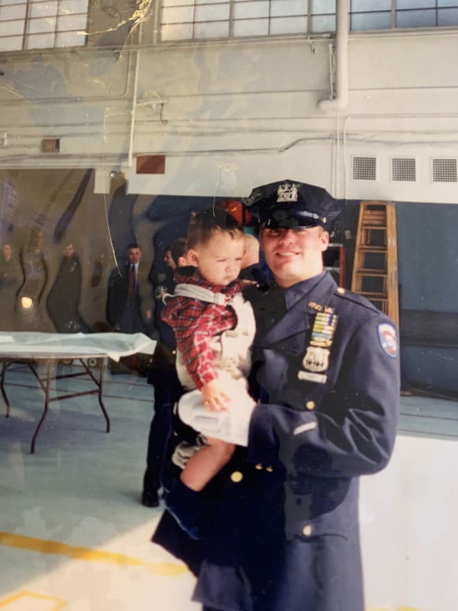 Dan Coan with Notre Dame football quarterback Jack Coan as a child