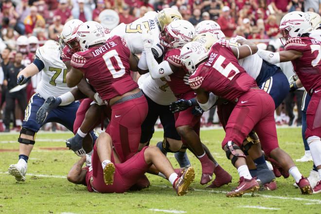 Fabien Lovett (0) and Jared Verse (5) are among the Seminoles to converge on this tackle. FSU's defense is getting healthier, Verse says, ahead of the final four regular-season games.