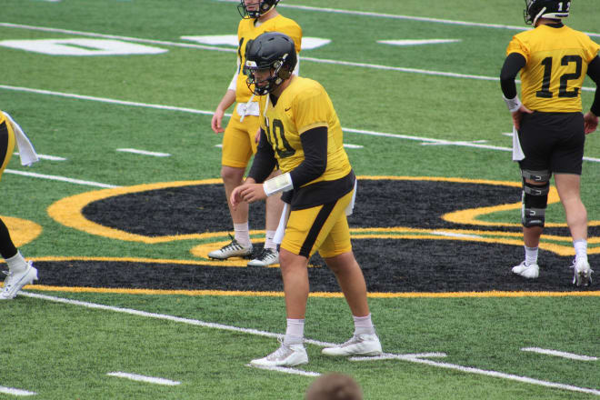 Deacon Hill takes a snap at Iowa's open spring practice. 