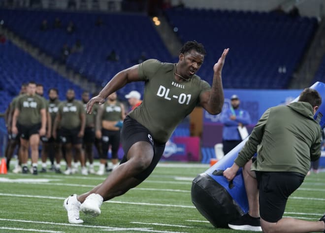 Wisconsin defensive lineman Keeanu Benton runs a drill at the 2023 NFL football scouting combine in Indianapolis