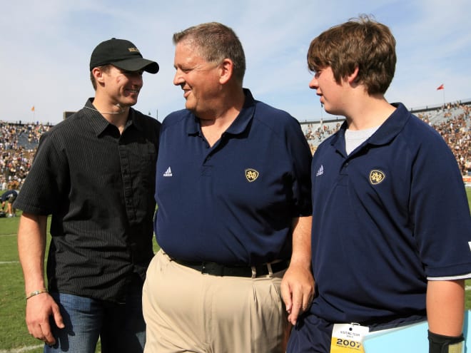 Charlie Weis Jr. (right) with his father and Drew Brees
