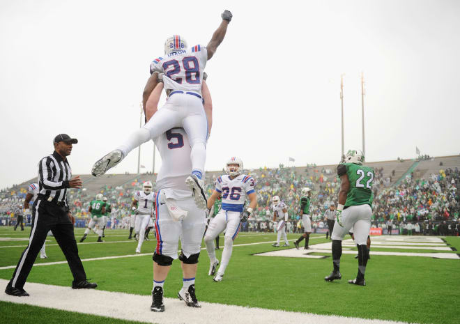 Kenneth Dixon celebrates a touchdown in the 2014 Conference USA Championship Game.