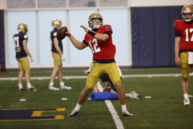 The quarterback competition features Jack Coan and Drew Pyne while Buchner learns the ropes.
