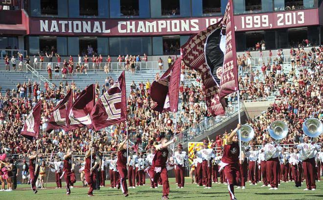 First the flags come out on the field before kickoff.