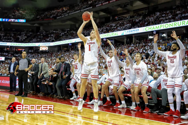 Brevin Pritzl (1) gets ready to knock down a 3-pointer that all his teammates know is coming in the victory over Marquette. 