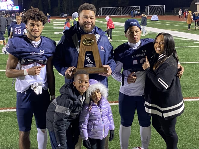 Charlotte (N.C.) Providence Day junior wide receiver Channing Goodwin, far left, celebrates the NCISAA Division I state title with his family.