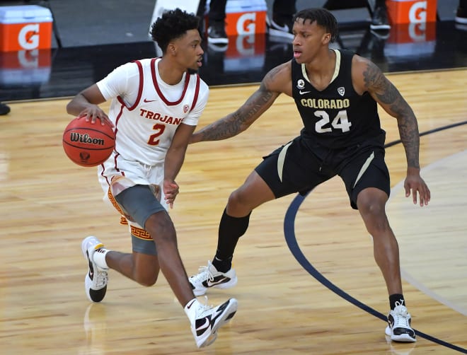 Eli Parquet guards USC's Tahj Eady in the 2021 Pac-12 Tournament semifinals game. CU won, 72-70.