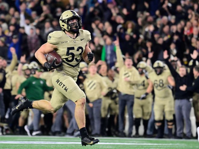 Looking.Forward: Army LB Kalib Fortner (#53) returns a fumble for a touchdown during the.2nd half against Navy