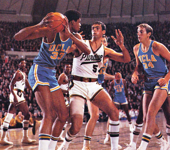 Chuck Bavis, show here guarding Alcindor, used his size to hold the Bruins' All-American to well below his scoring average.
