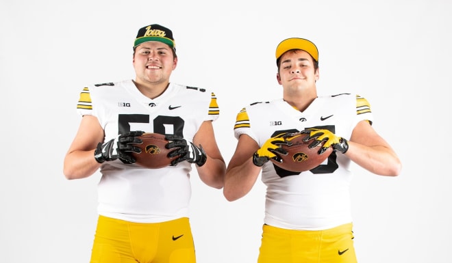 Trevor Lauck, left, with Hawkeye commit Leighton Jones, right, in Iowa City today.