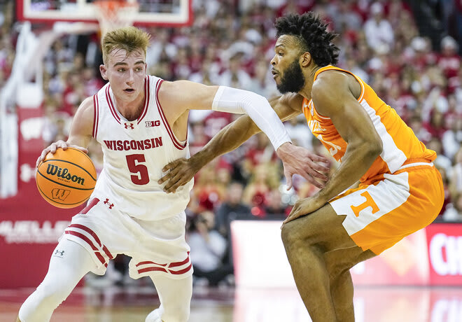 Wisconsin's Tyler Wahl (5) drives against Tennessee's Josiah-Jordan James (30) on Nov.10, 2023