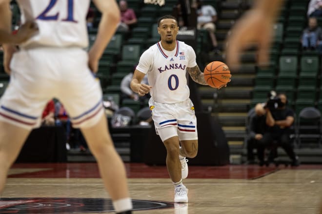 Bobby Pettiford brings the ball up-the-court for Kansas