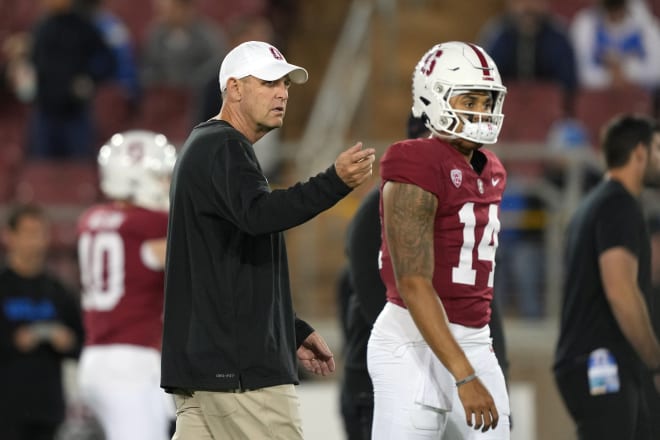 Stanford head coach Troy Taylor talking with quarterback Ashton Daniels. 