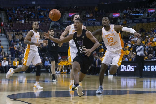 Washington guard Quade Green, center, gathers the ball during the first half of an NCAA college basketball game against Tennessee in the James Naismith Classic, in Toronto on Saturday, Nov. 16, 2019. (Chris Young/The Canadian Press via AP) 