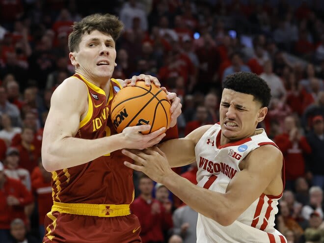 Iowa State's Caleb Grill fouls Wisconsin's Johnny Davis during the first half. Davis finished with 17 points on 4-for-13 shooting.