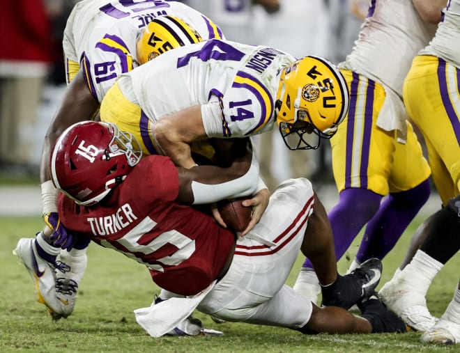  LSU Tigers quarterback Max Johnson (14) is sacked by Alabama Crimson Tide linebacker Dallas Turner (15) during the second half at Bryant-Denny Stadium. Photo | Butch Dill-USA TODAY Sports