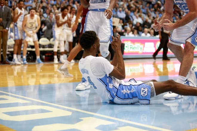 Robinson embraces the little things, like taking charges, to help the Heels win.