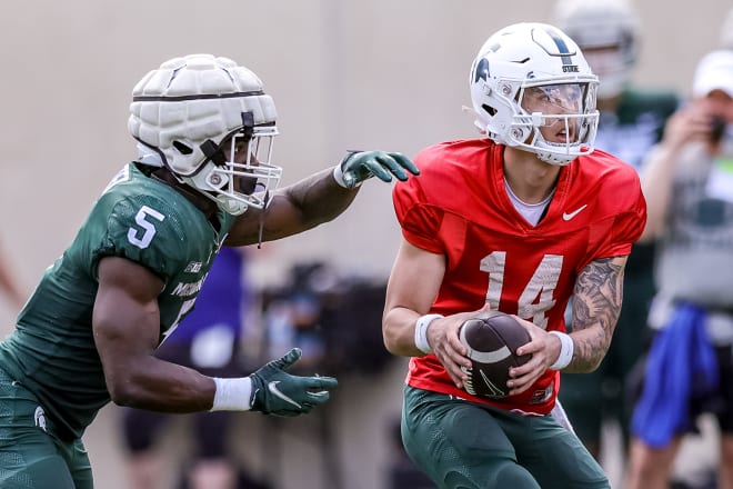 Nathan Carter receives a hand off during the Spartan Footbal Kickoff on April 15, 2023. Photo credit: Marvin Hall/Spartans Illustrated